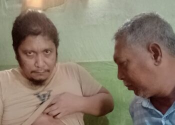 Muhammad Syukur (baju cokelat) ditembak di bagian perut dalam insiden kekerasan di Simpang KKA, Aceh Utara. (Foto: dokumen pribadi)